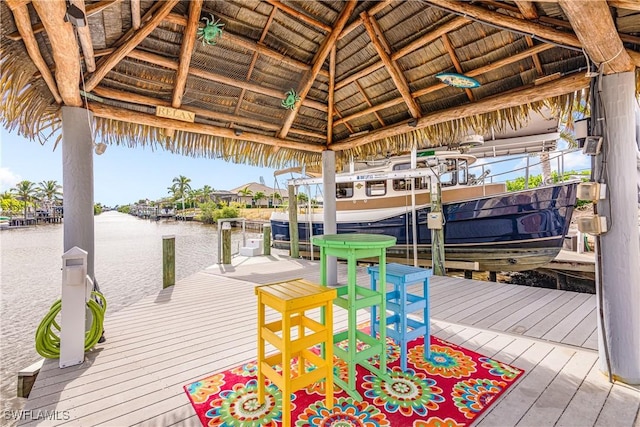 dock area with a gazebo and a water view