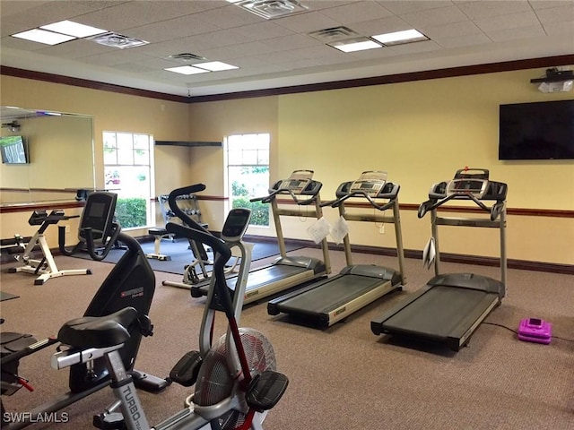 exercise room with ornamental molding