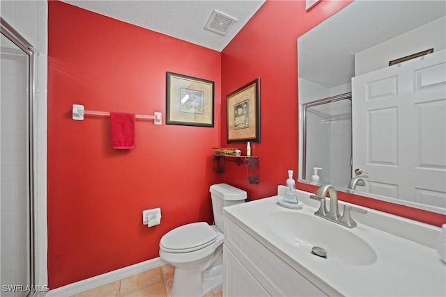 bathroom with tile patterned floors, a textured ceiling, toilet, vanity, and a shower with shower door