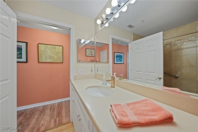 bathroom featuring vanity and wood-type flooring