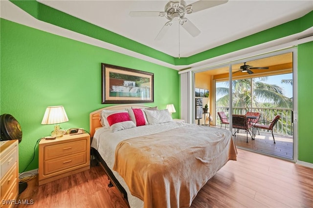 bedroom featuring access to outside, ceiling fan, and hardwood / wood-style flooring