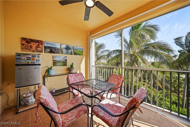 sunroom / solarium with ceiling fan and a wealth of natural light