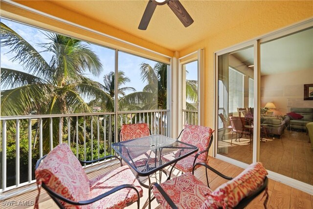 sunroom / solarium with ceiling fan