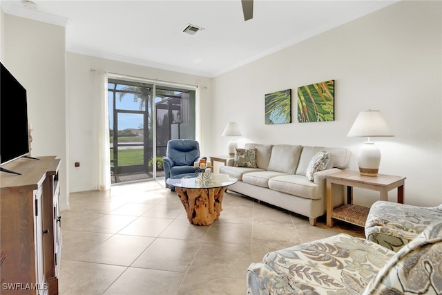 tiled living room featuring ceiling fan and ornamental molding