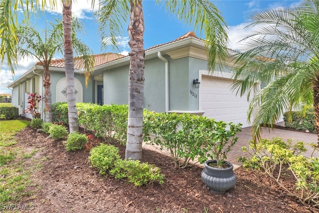 view of property exterior featuring a garage