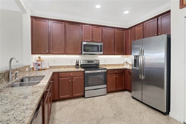 kitchen with light stone counters, sink, ornamental molding, and stainless steel appliances