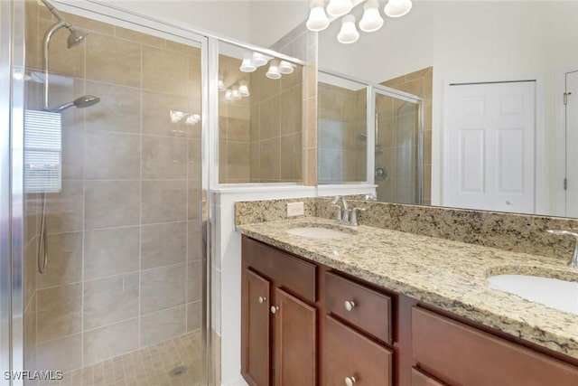 bathroom with vanity and a shower with shower door