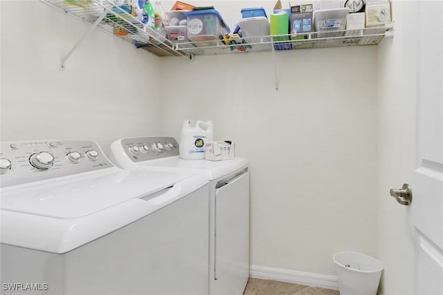 clothes washing area with independent washer and dryer