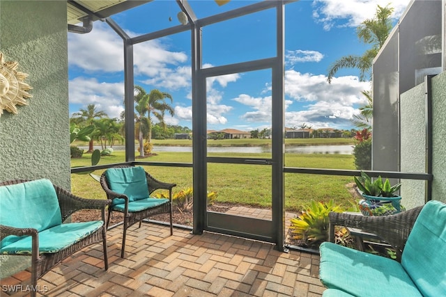 sunroom with a water view