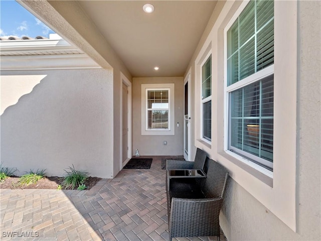 entrance to property featuring a patio