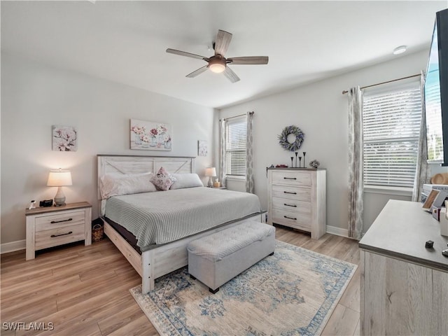 bedroom with ceiling fan and light wood-type flooring