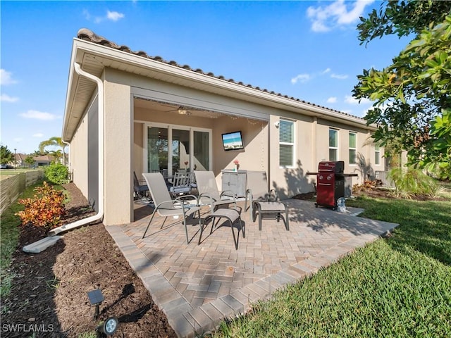 back of house with a patio and ceiling fan