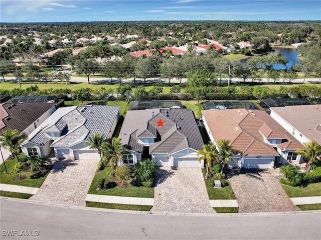 birds eye view of property with a water view