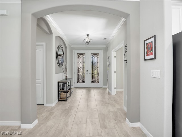 entryway with french doors and crown molding