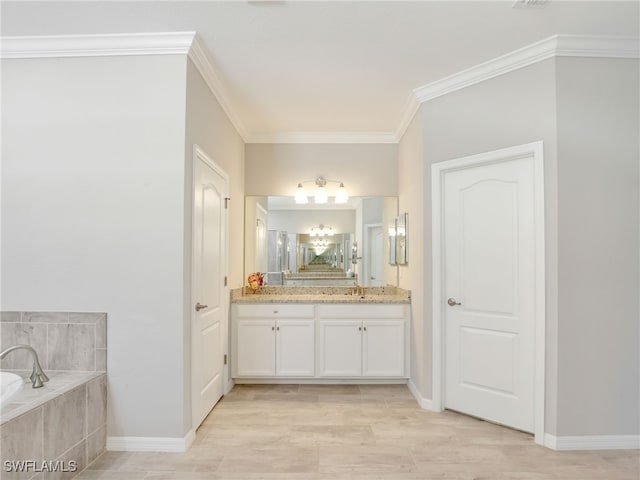 bathroom with vanity, tile patterned flooring, ornamental molding, and tiled bath