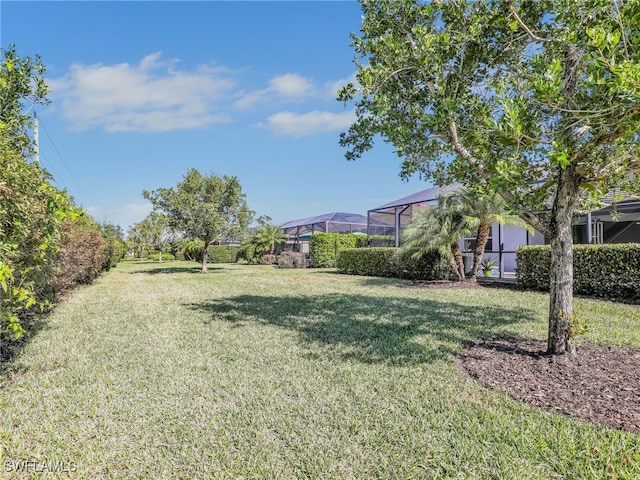 view of yard featuring a lanai