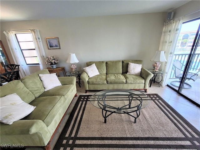 living room with light tile patterned floors and plenty of natural light