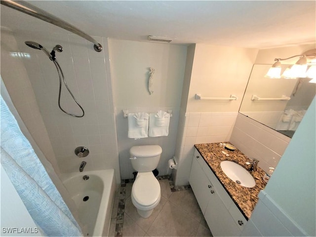 full bathroom with tile patterned flooring, vanity, toilet, and shower / bath combo