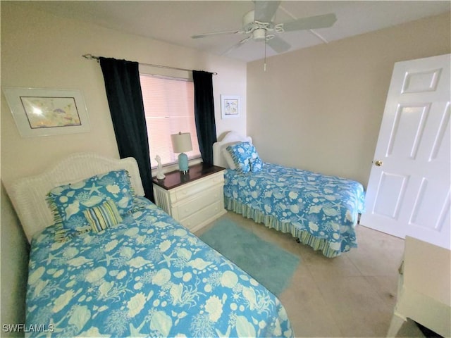 bedroom with ceiling fan and light tile patterned flooring