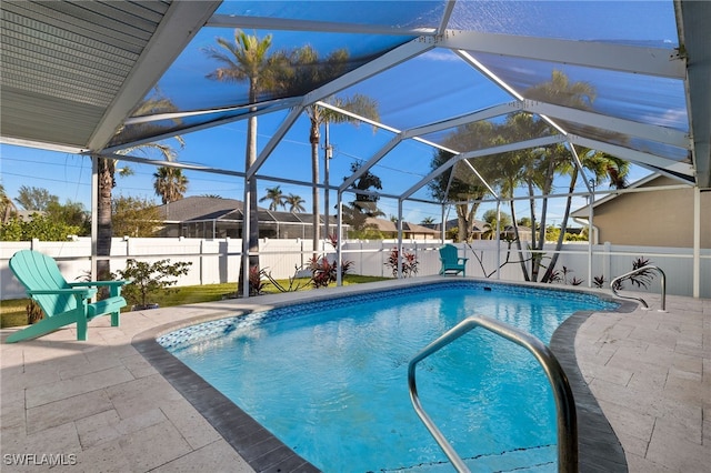 view of pool featuring a patio area and a lanai