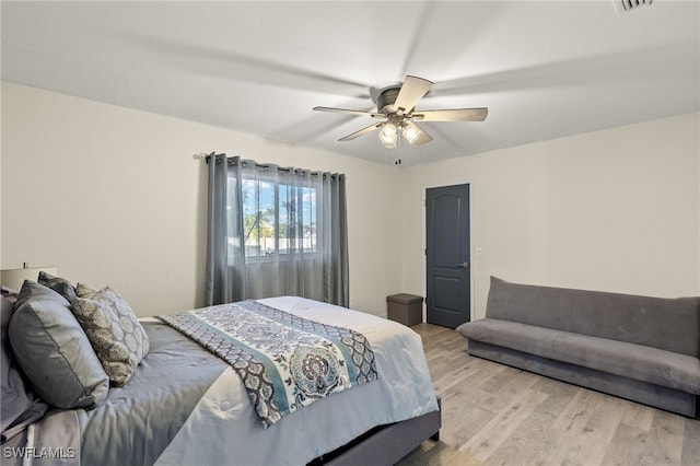 bedroom featuring ceiling fan and light hardwood / wood-style flooring