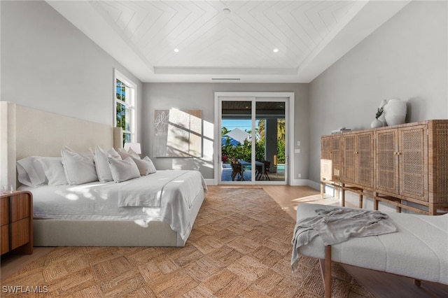 bedroom with access to exterior, a raised ceiling, and wood ceiling