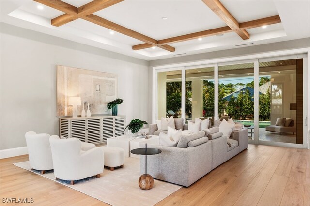 living room with beamed ceiling, wood-type flooring, and coffered ceiling