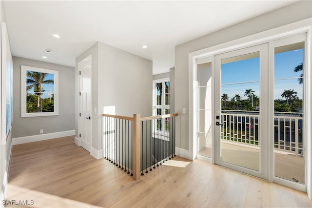 doorway with light hardwood / wood-style floors