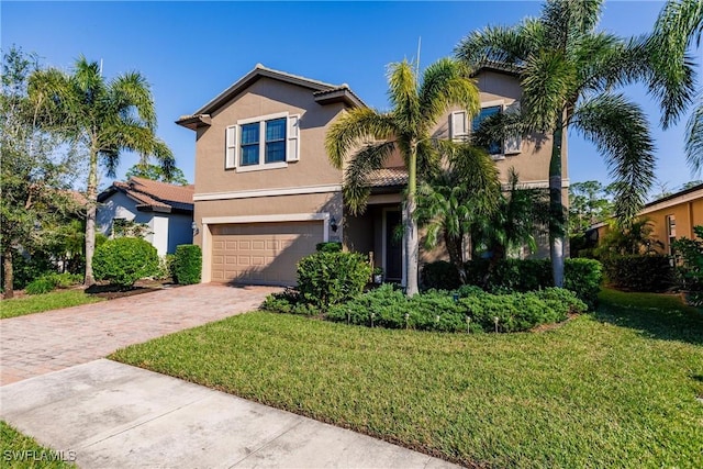 view of front facade featuring a front yard and a garage