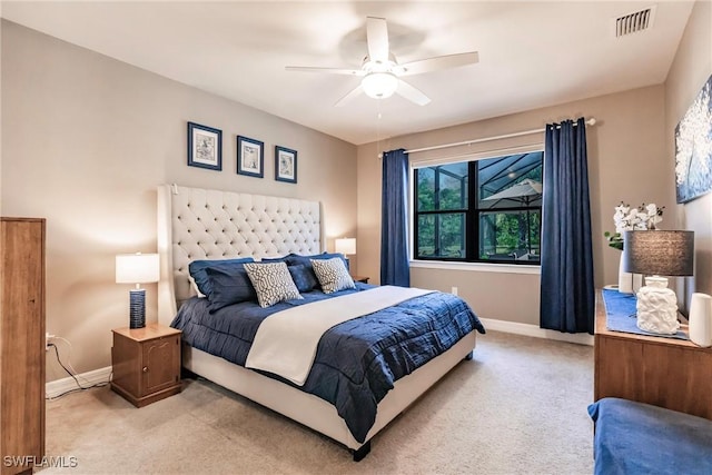 bedroom with light carpet, baseboards, and visible vents