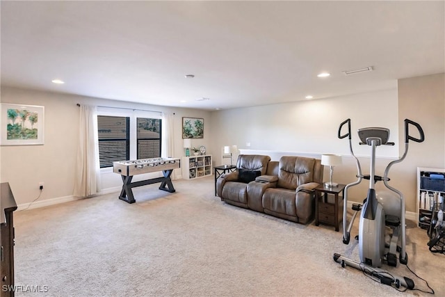 living room featuring carpet, baseboards, and recessed lighting