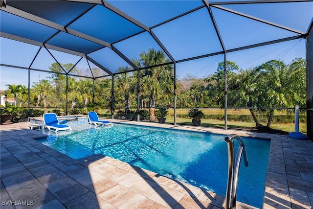 pool featuring a lanai and a patio area