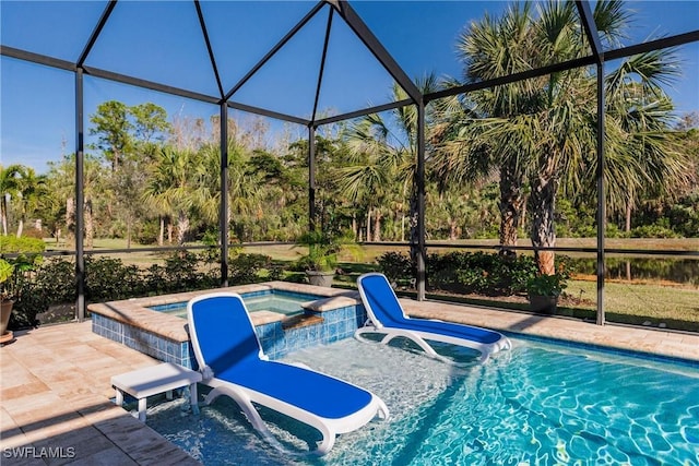 view of pool with glass enclosure and an in ground hot tub