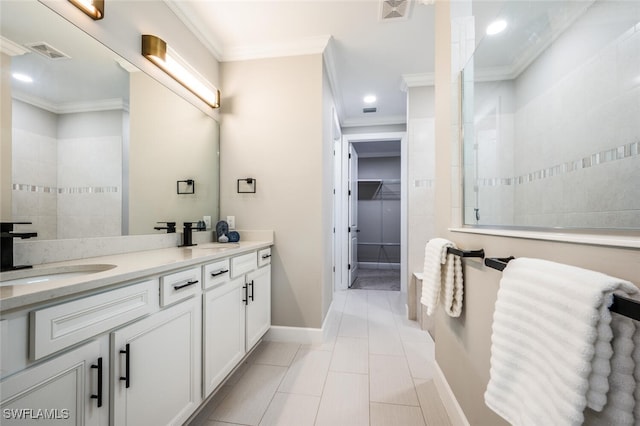 bathroom with vanity, crown molding, and walk in shower