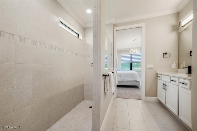 ensuite bathroom featuring ensuite bath, ornamental molding, tile patterned flooring, walk in shower, and vanity