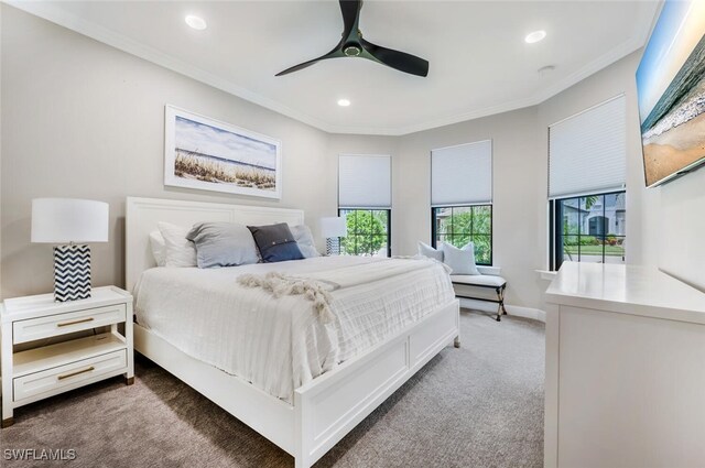 bedroom featuring carpet, ceiling fan, and crown molding