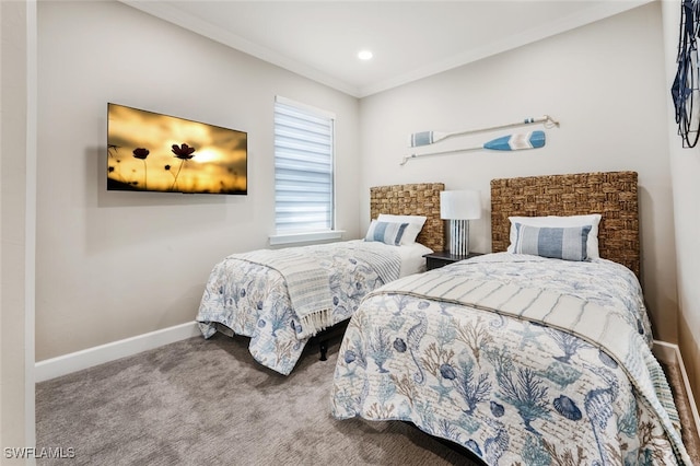 carpeted bedroom with baseboards and ornamental molding