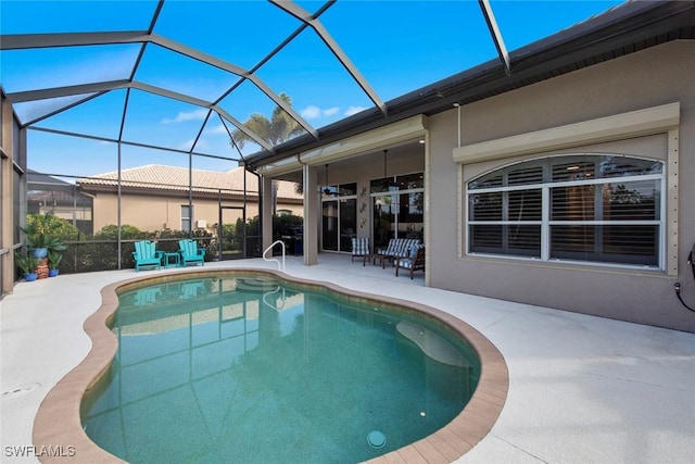 view of pool featuring a patio and a lanai