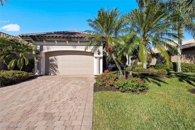 mediterranean / spanish-style home featuring a front lawn