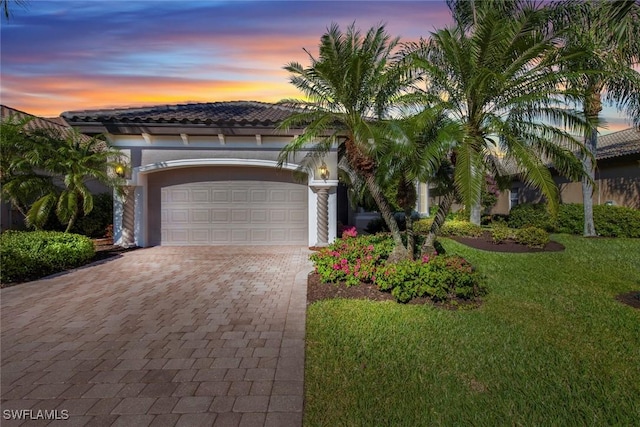 mediterranean / spanish house featuring a lawn