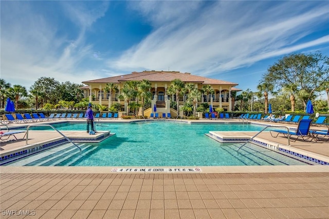 view of swimming pool featuring a patio