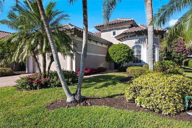 view of side of home featuring a yard