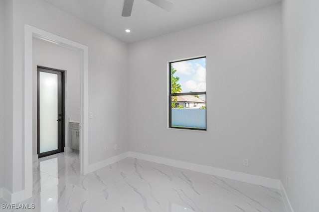 spare room with ceiling fan