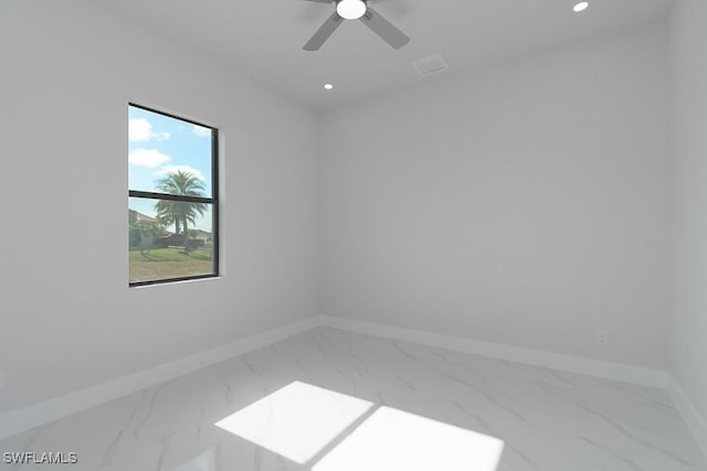 spare room featuring ceiling fan