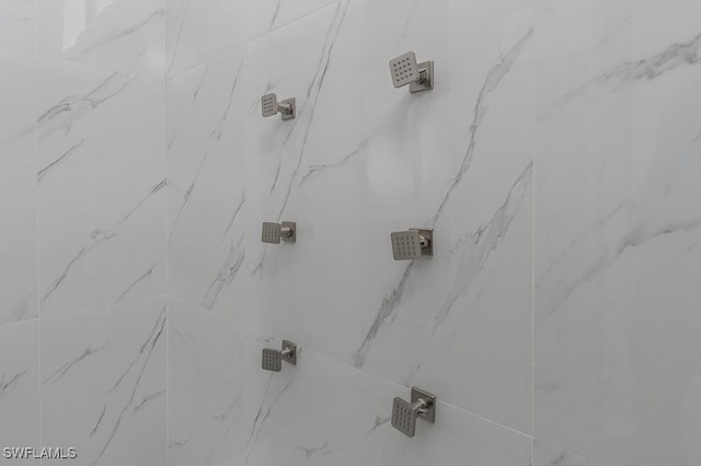 details with a tile shower