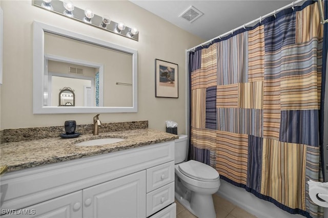 full bathroom with tile patterned flooring, shower / bath combo, vanity, and toilet