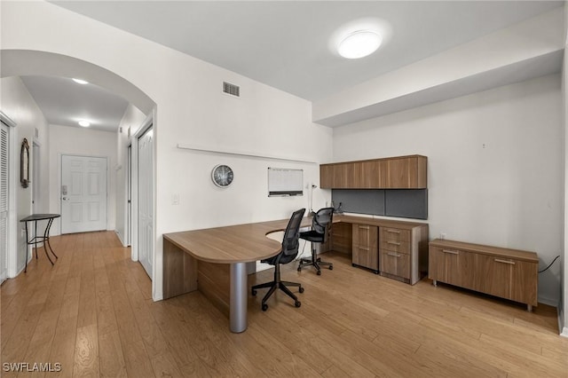 office with light hardwood / wood-style flooring