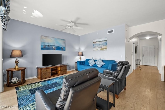 living room featuring ceiling fan and light wood-type flooring