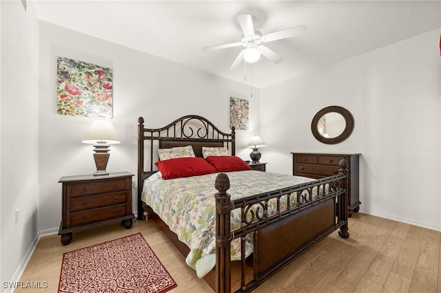 bedroom with ceiling fan and light hardwood / wood-style flooring