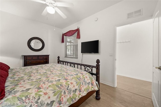 bedroom featuring light hardwood / wood-style floors and ceiling fan